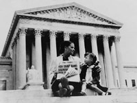 Mrs. Nettie Hunt and daughter Nikie on the steps of the Supreme Court, 1954