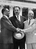 George E. C. Hayes, Thurgood Marshall, and James M. Nabrit congratulating each other