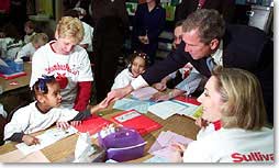 President George W. Bush greets a student at Sullivant Elementary School in Columbus Ohio on February 20, 2001. The president traveled to the school to emphasize accountability of school for the quality of education they provide. (White House Photo by Paul Morse)