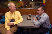 Peter Young, director of the Department of Land and Natural Resources, Honolulu, Hawaii, talks with a sailor aboard the USS Mount Whitney off the coast of Naples, Italy, during the Joint Civilian Orientation Conference visit to the ship, Oct. 21, 2005. U.S. Air Force photo by Staff Sgt. Suzanne Day