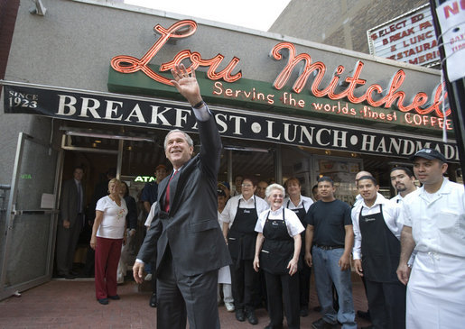 President George W. Bush waves as he leaves Lou Mitchell’s Restaurant in Chicago, Friday, July 7, 2006, following a breakfast meeting with local business leaders at the restaurant. White House photo by Kimberlee Hewitt