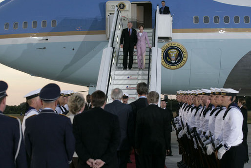 President George W. Bush and Laura Bush are greeted as they arrive Wednesday, July 12, 2006, at Rostock-Laage Airport in Rostock, Germany. The couple later boarded Marine One for a short ride to Heiligendamm, where they are the guests of Germany's Chancellor Angela Merkel before proceeding Friday to the G8 Summit in Russia. White House photo by Eric Draper