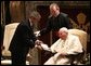 President George W. Bush presents Pope John Paul II with the Medal of Freedom at the Vatican, Friday, June 4, 2004. White House photo by Tina Hager