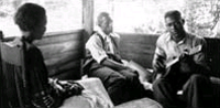 Zora Neale Hurston, Rochelle Harris and Gabriel Brown in Eatonville, Fla., during the Lomax-Hurston-Barnicle recording expedition to Georgia, Florida and the Bahamas, June 1935