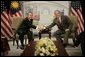 President George W. Bush and Prime Minister Abdullah Ahmad Badawi of Malaysia, exchange handshakes during their meeting Thursday, Nov. 17, 2005, at the Chosun Westin Hotel in Busan, Korea. White House photo by Eric Draper