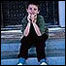 Photo: A young boy sitting on stairs