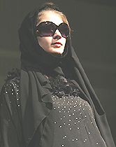 Women in the Persian Gulf countries wear abaya for modesty and protection from the hot, dry climate 