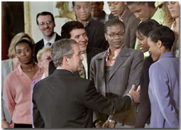 President George W. Bush greets members of the WNBA's Houston Comet's during a Photo Op in the East Room, Monday, May 14. WHITE HOUSE PHOTO BY ERIC DRAPER