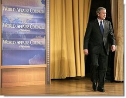 President George W. Bush walks onto the stage during his introduction before delivering remarks on the War on Terror in front of members of the World Affairs Council of Philadelphia, Monday, Dec. 12, 2005.  White House photo by Eric Draper