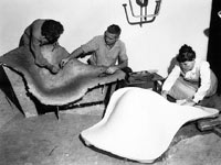 Staff Members Frances Bishop and Robert Jacobsen with a papier-maché study and Ray with a plaster mold for La Chaise