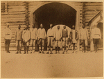 Line of men in front of prison entrance