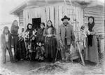Indigenous Family Standing Outside Home