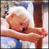 A boy lying on a sofa