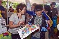 A woman and young boy looking at a map.