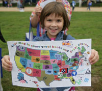 Bridie Daley, 9, from Frederick, Md., displays her literary map of the United States, "Discover Great Places Through Reading." 