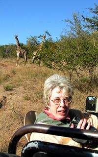 Catherine Gourley, director of the Center for the Book's Letters About Literature program, encounters giraffes at the Mthethomusha game reserve.