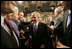 President George W. Bush is congratulated by Tennessee Rep. Harold Ford and Louisiana Sen. Mary Landrieu as he leaves the U.S. House Chamber Tuesday, Jan. 31, 2006, following his State of the Union address.