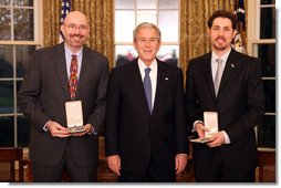 President George W. Bush stands with Mike Feinberg and Dave Levin after presenting them with the 2008 Presidential Citizens Medal Wednesday, Dec. 10, 2008, in the Oval Office of the White House. White House photo by Chris Greenberg