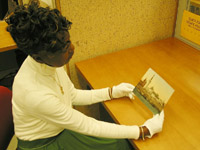 Staff member examining a photochrom print