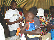 Photo: Pharmacist Tony Sang speaks to a patient