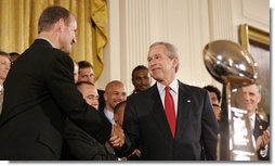 President George W. Bush shakes hands with Pittsburgh Steelers coach Bill Cowher, as he welcomes the Super Bowl Champion Pittsburgh Steelers to the White House, Friday, June 2, 2006, during a ceremony in the East Room to honor the Super Bowl champs. White House photo by Eric Draper