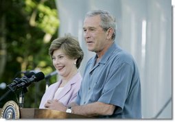 President George W. Bush and Laura Bush welcome guests to the annual Congressional Picnic on the South Lawn of the White House Wednesday evening, June 15, 2006, hosting members of Congress and their families to the "Rodeo" theme picnic.  White House photo by Paul Morse