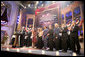 President George W. Bush and Mrs. Laura Bush are joined on stage by the cast of entertainers performing at the annual Ford's Theater gala to benefit the historic theater. The program, 