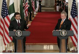 President George W. Bush listens as President Pervez Musharraf, of the Islamic Republic of Pakistan, responds to a question Friday, Sept. 22, 2006, during a joint press availability at the White House.  White House photo by Eric Draper