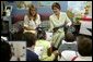 Laura Bush and her daughter Jenna read with a second grade class at Hueytown Elementary School in Birmingham, Ala., Wednesday, July 14, 2004. White House photo by Joyce Naltchayan