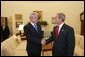 President George W. Bush meets with Prime Minister Adrian Nastase of Romania in the Oval Office Wednesday, July 21, 2004 White House photo by Eric Draper.