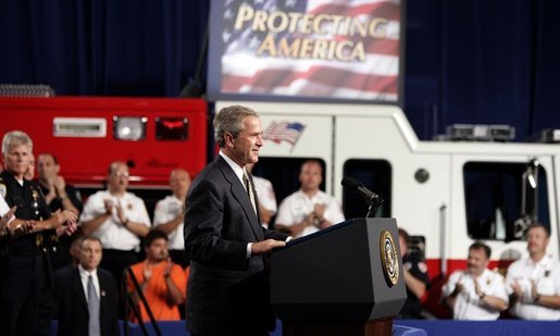 President George W. Bush receives applause during remarks on homeland security at Northeastern Illinois Public Training Academy in Glenview, Illinois on Thursday July 22, 2004. White House photo by Paul Morse.