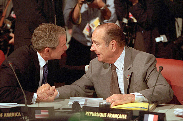 President Bush and President Chirac of France talk over issues during the G-8 sessions, July 21, 2001. White House photo by Paul Morse.