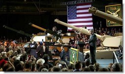 President George W. Bush addresses employees of the Lima Army Tank Plant, where the Abrams M1A2 tank is built, in Lima, Ohio, April 24, 2003. "I'm here to thank you all for your service to our country, and thank you for the vital contribution you have made to peace and freedom," said the President in his remarks. "And each of you have had a part in this mission. Each of you are a part to making sure this country is strong enough to keep the peace."  White House photo by Paul Morse