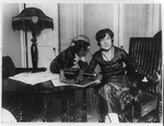 Mme. Asta Souvorina, 'the Bernhardt of Russia,' ... and Buster [dog] listening in on the radiophone