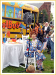Popular science teacher Mrs. Frizzle in front of The Magic School Bus.
