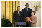 Mrs. Laura Bush stands with Ruth Riley, Detroit Shock WNBA player, left, and Brendan Haywood, Washington Wizards NBA player