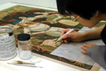 Photo of Conservator treating  poster