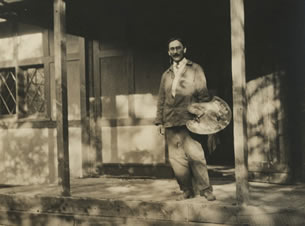 F. Tolles Chamberlin standing outside Adams Studio, ca. 1914.