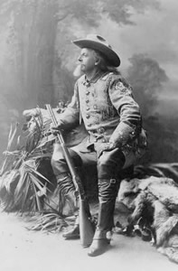 Photo of Buffalo Bill Cody holding a rifle.