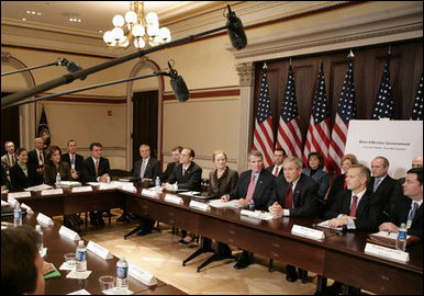 President George W. Bush talks with members of the media at the President's Management Council meeting, Friday, Oct. 13, 2006, at the Eisenhower Executive Office Building in Washington, D.C. The council met to discuss the President's Management Agenda accomplishments, which will be summarized in a government-wide report to Federal employees and Congress on the state of the government's management practices. White House photo by Eric Draper