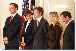 U.S. Supreme Court Justice Samuel A. Alito is seen, Tuesday, Feb. 1, 2006 in the East Room of the White House, with his wife, Martha-Ann, their son Phil, daughter, Laura, and U.S. Supreme Court Chief Justice John Roberts prior to being sworn-in.  White House photo by Shealah Craighead