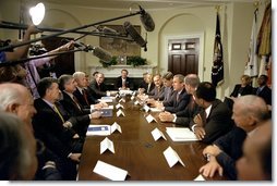 Addressing the media, President George W. Bush meets with corporate leaders in the Roosevelt Room June 13. "You know, there's been a lot of talk about corporate responsibility here in America, and there needs to be," said the President. "People who run their businesses need to do so in a way that treats their employees with respect, and treats the communities in which they live with respect, as well." White House photo by Paul Morse.