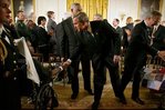 President George W. Bush speaks with Pvt. 1st Class Phillip Ramsey after signing The Emergency Supplemental Appropriations Act for Defense and for The Reconstruction of Iraq and Afghanistan in the East Room Thursday, Nov. 6, 2003.  White House photo by Susan Sterner