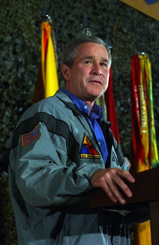 President George W. Bush delivers remarks to troops on Thanksgiving Day in Baghdad, Iraq. Thursday, November 27, 2003. White House photo by Tina Hager.
