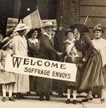 Woman holding a suffrage banner.