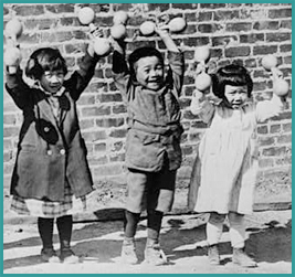 Five Asian children holding up small barbells