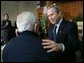 President George W. Bush talks with a retiree during a visit to The Life Project Senior Development Center in Orlando, Fla. Friday, March 18, 2005. White House photo by Eric Draper