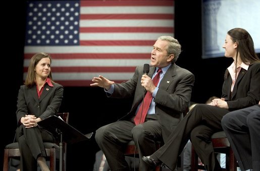 President George W. Bush discusses his proposal to reform Social Security with University of Louisville students Lindsey Mottley, left, and Rebecca Dean, right, in Louisville, Ky., Thursday, March 10, 2005. White House photo by Paul Morse