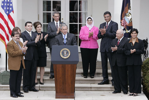 Accompanied by Iraqi citizens who voted in the recent elections, President George W. Bush delivers remarks about freedom in Iraq in the Rose Garden Tuesday, March 29, 2005. "I want to thank you for your strong belief in democracy and freedom. It's a belief that, with their vote, the Iraqi people signal to the world that they intend to claim their liberty and build a future of freedom for their country," said President Bush. "And it was a powerful signal." White House photo by Eric Draper