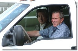President George W. Bush and Japanese Prime Minister Junichiro Koizumi begin a tour of the President's ranch near Crawford, Texas, after the Prime Minister's arrival Thursday afternoon, May 22, 2003.  White House photo by Tina Hager
